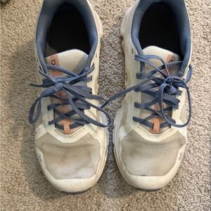 On Running Cream and Blue Athletic Shoes